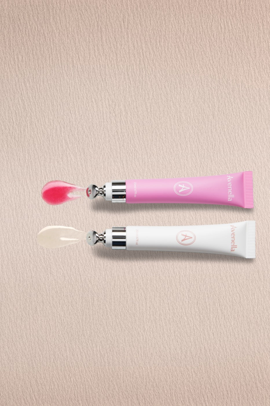Both applicators with a swatch of each balm: Rose in soft pink, Vanilla clear