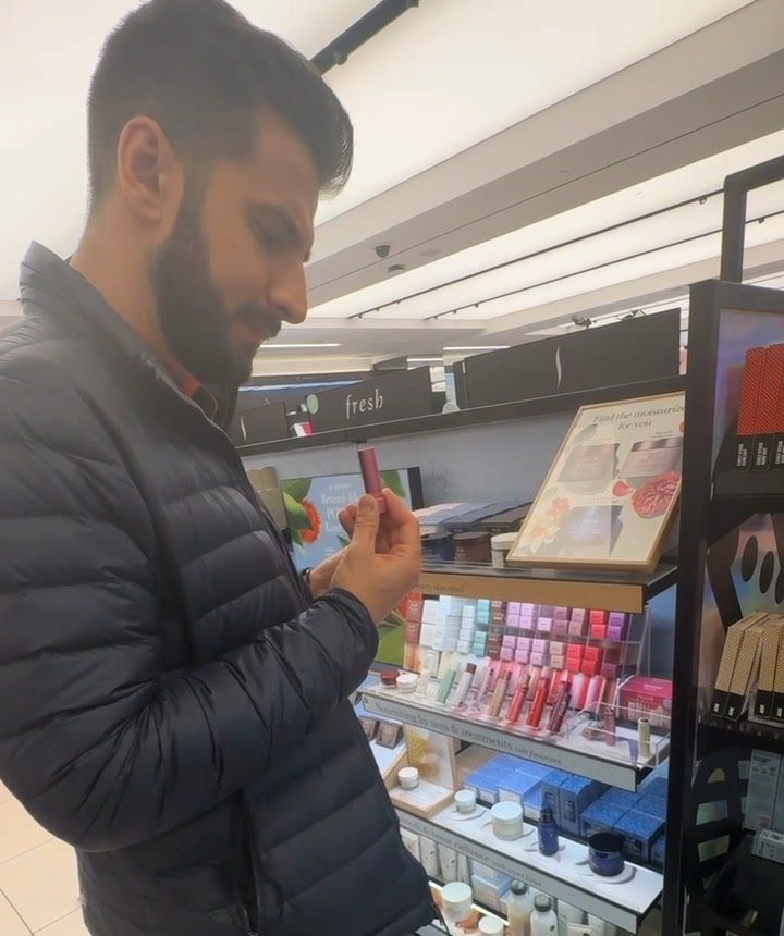 Vadim at Sephora, reading the ingredients on a lip product