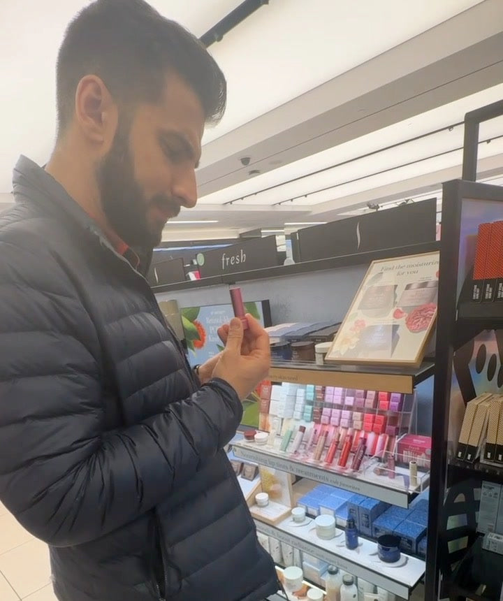 Vadim at Sephora, reading the ingredients on a lip product