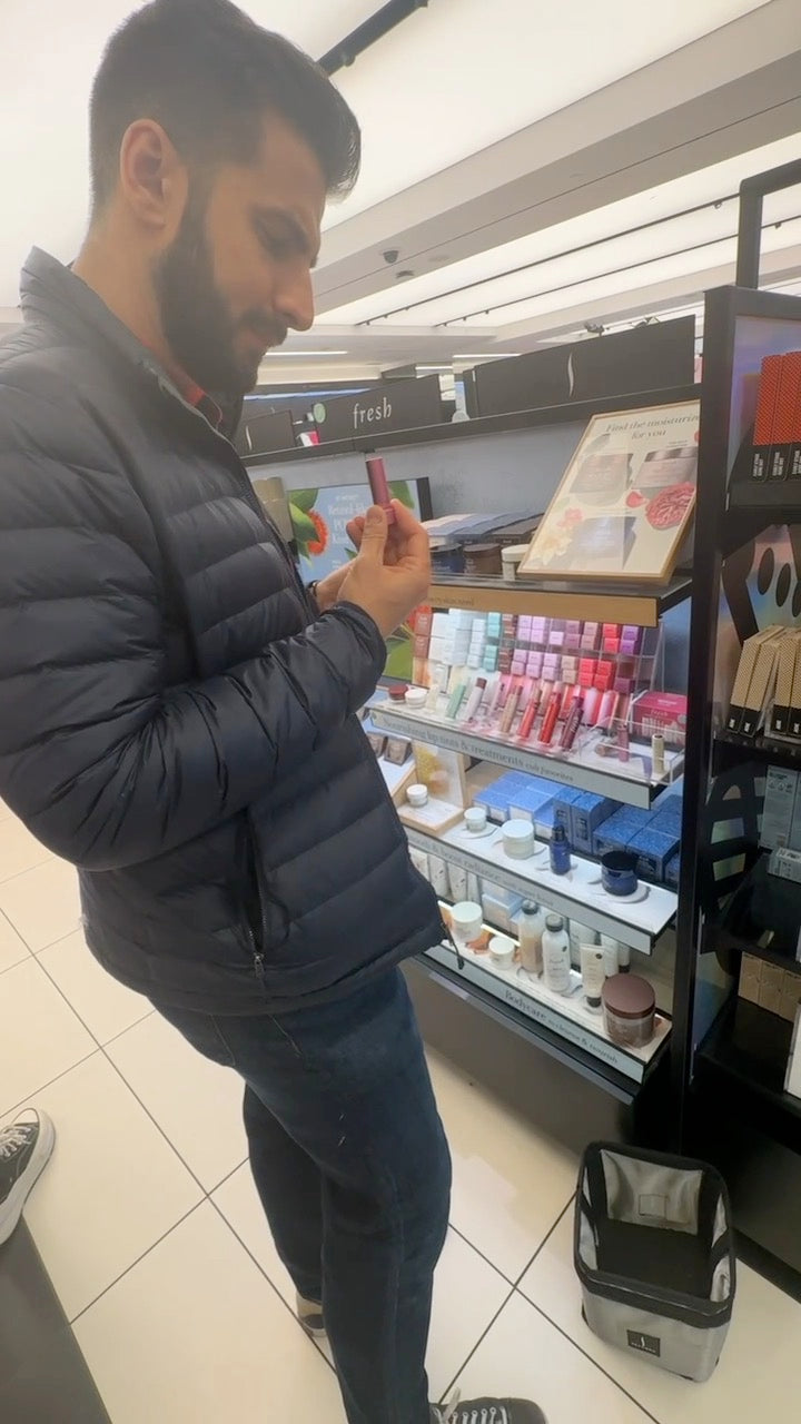 Vadim at Sephora, reading the ingredients on a lip product