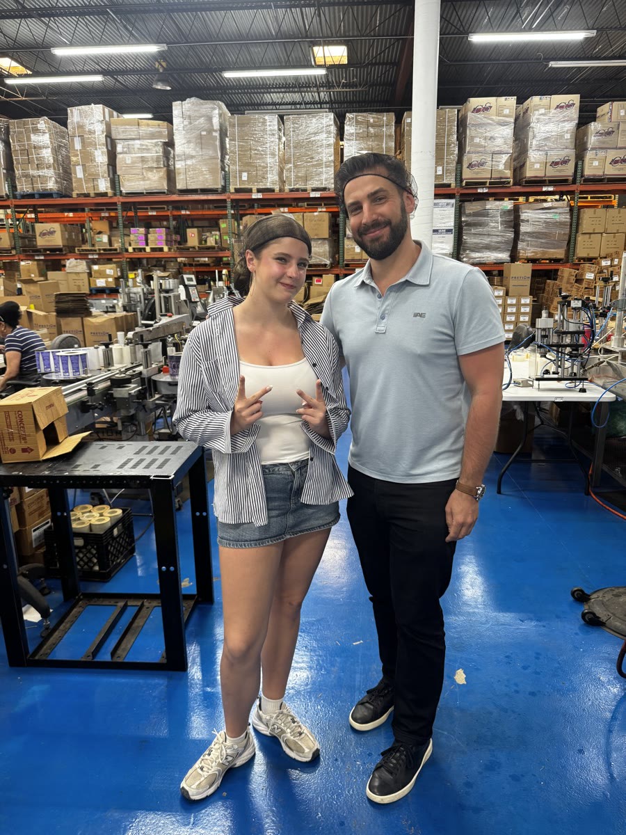 Noa and Vadim standing together at their manufacturing facility
