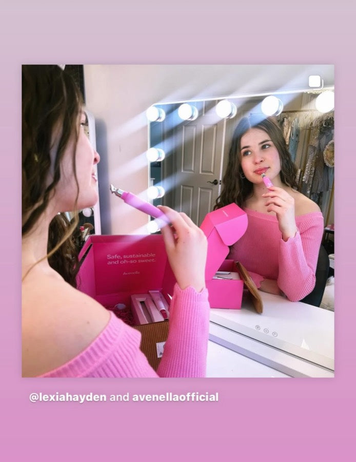 Lexia applying Rose at her vanity mirror