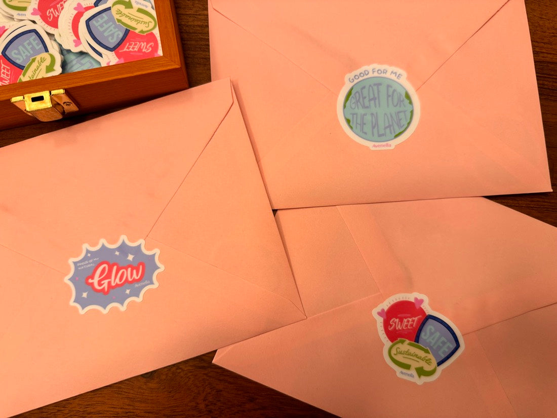 Pink mailing envelopes decorated with Avenella stickers